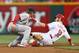 CINCINNATI, OH - SEPTEMBER 05: Tony Cingrani #52 of the Cincinnati Reds slides safely into second base ahead of the tag by Ryan Jackson #8 of the St. Louis Cardinals at Great American Ball Park on September 5, 2013 in Cincinnati, Ohio. (Photo by Andy Lyons/Getty Images)