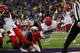 SEATTLE, WA - SEPTEMBER 28: Running Back Ka'Deem Carey #25 of the Arizona Wildcats scores a touchdown during the second quarter past Sean Parker #1 of the Washington Huskies on September 28, 2013 at Husky Stadium in Seattle, Washington. (Photo by Kevin Casey/Getty Images)