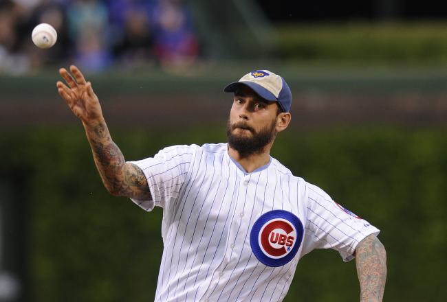 Hi-res-144039599-champion-cm-punk-throws-out-the-first-pitch-before-the_crop_north