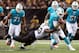 Sep 30, 2013; New Orleans, LA, USA; Miami Dolphins quarterback Ryan Tannehill (17) fumbles the ball as he is tackled by New Orleans Saints middle linebacker Curtis Lofton (50) in the second quarter at Mercedes-Benz Superdome. Mandatory Credit: Crystal LoGiudice-USA TODAY Sports