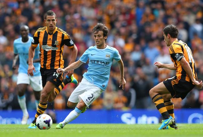 Hi-res-178918677-david-silva-of-manchester-city-beats-robert-koren-and_crop_north