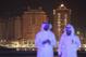 DOHA, QATAR - OCTOBER 27: Newly-constructed apartment buildings at a development called The Pearl loom beind two Arab men wearing dishdashas on October 27, 2011 in Doha, Qatar. Qatar, which is undergoing rapid urban development, will host the 2022 FIFA World Cup football competition and is slated to tackle a variety of infrastructure projects, including the construction of new stadiums. (Photo by Sean Gallup/Getty Images)