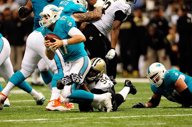 Hi-res-182567392-ryan-tannehill-of-the-miami-dolphins-is-sacked-by_crop_north
