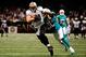 NEW ORLEANS, LA - SEPTEMBER 30: Chris Clemons #30 of the Miami Dolphins tries to tackle Jimmy Graham #80 of the New Orleans Saints during a game at the Mercedes-Benz Superdome on September 30, 2013 in New Orleans, Louisiana. The Saints defeated the Dolphins 38-17. (Photo by Stacy Revere/Getty Images)