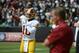 Sep 29, 2013; Oakland, CA, USA; Washington Redskins quarterback Robert Griffin III (10) warms up in front of head coach Mike Shanahan (right) before the game against the Oakland Raiders at O.co Coliseum. Mandatory Credit: Kyle Terada-USA TODAY Sports