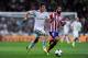 MADRID, SPAIN - SEPTEMBER 28: Gareth Bale of Real Madrid duels for the ball with Arda Turan of Atletico de Madrid during the La Liga match between Real Madrid CF and Club Atletico de Madrid at Bernabeu on September 28, 2013 in Madrid, Spain. (Photo by David Ramos/Getty Images)