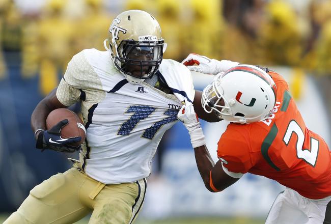 Hi-res-152589231-deon-bush-of-the-miami-hurricanes-makes-a-tackle_crop_north