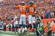 DENVER, CO - SEPTEMBER 29: Wide receiver Demaryius Thomas #88 of the Denver Broncos celebrates a third quarter touchdown with Virgil Green #85 of the Philadelphia Eagles at Sports Authority Field Field at Mile High on September 29, 2013 in Denver, Colorado. (Photo by Dustin Bradford/Getty Images)