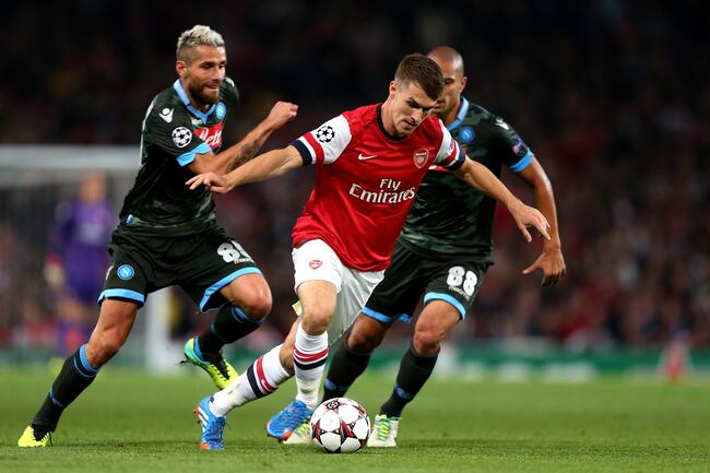 Hi-res-182603506-aaron-ramsey-of-arsenal-is-pursued-by-valon-behrami-and_crop_north