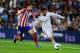 MADRID, SPAIN - SEPTEMBER 28: Francisco Alarcon Isco of Real Madrid CF duels for the ball with Gabi Fernandez of Atletico de Madrid during the La Liga match between Real Madrid CF and Club Atletico de Madrid at Bernabeu on September 28, 2013 in Madrid, Spain. (Photo by David Ramos/Getty Images)
