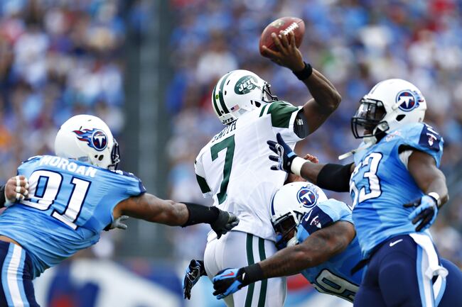 Hi-res-182388189-geno-smith-of-the-new-york-jets-is-hit-while-throwing-a_crop_north
