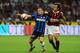 MILAN, ITALY - AUGUST 29: Andrea Pirlo of AC Milan battles for the ball with Wesley Sneijder of FC Inter Milan during the Serie A match between AC Milan and Inter Milan at Stadio Giuseppe Meazza on August 29, 2009 in Milan, Italy. (Photo by Valerio Pennicino/Getty Images)
