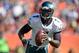 Sep 29, 2013; Denver, CO, USA;Philadelphia Eagles quarterback Michael Vick (7) scrambles against the Denver Broncos in the first quarter at Sports Authority Field at Mile High. Mandatory Credit: Ron Chenoy-USA TODAY Sports