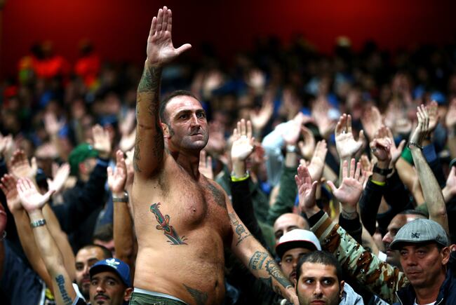 Hi-res-182601943-napoli-fans-cheer-on-their-team-during-uefa-champions_crop_north