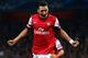 LONDON, ENGLAND - OCTOBER 01: Mesut Oezil of Arsenal celebrates after scoring the opening goal during UEFA Champions League Group F match between Arsenal FC and SSC Napoli at Emirates Stadium on October 1, 2013 in London, England. (Photo by Paul Gilham/Getty Images)