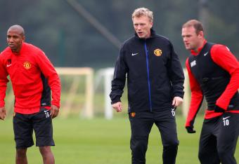 Hi-res-182578529-ashley-young-wayne-rooney-and-manager-david-moyes-of_crop_north