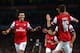 LONDON, ENGLAND - OCTOBER 01: Mesut Oezil #11of Arsenal is congratulated by teammate Aaron Ramsey #16 after scoring the opening goal during UEFA Champions League Group F match between Arsenal FC and SSC Napoli at Emirates Stadium on October 1, 2013 in London, England. (Photo by Paul Gilham/Getty Images)