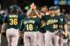 SEATTLE, WA - SEPTEMBER 29: Members of the Oakland Athletics celebrate after defeating the Seattle Mariners 9-0 at Safeco Field on September 29, 2013 in Seattle, Washington. (Photo by Otto Greule Jr/Getty Images)