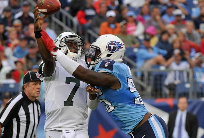 Hi-res-182406900-quarterback-geno-smith-of-the-new-york-jets-is-hit-by_crop_north