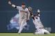 MINNEAPOLIS, MN - SEPTEMBER 29: Jason Kipnis #22 and Nick Swisher #33 of the Cleveland Indians celebrate a win of the game against the Minnesota Twins on September 29, 2013 at Target Field in Minneapolis, Minnesota. The Indians defeated the Twins 5-1 and clinched a American League Wild Card berth. (Photo by Hannah Foslien/Getty Images)