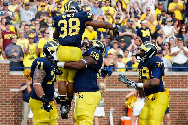 Hi-res-179040177-thomas-rawls-of-the-michigan-wolverines-celebrates-his_crop_north