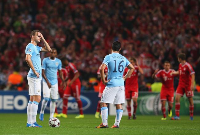 Hi-res-182936084-edin-dzeko-of-manchester-city-looks-dejected-with_crop_north