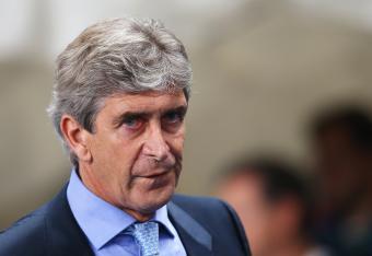 Hi-res-182936275-manuel-pellegrini-coach-of-manchester-city-looks-on_crop_north
