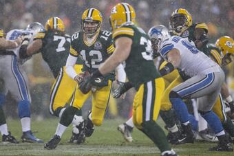 Hi-res-158268317-aaron-rodgers-of-the-green-bay-packers-rolls-out-of-the_crop_north