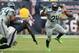 Sep 29, 2013; Houston, TX, USA; Seattle Seahawks running back Marshawn Lynch (24) runs with the ball in overtime against Houston Texans linebacker Willie Jefferson (54) at Reliant Stadium. The Seattle Seahawks beat the Houston Texans 23-20 in overtime. Mandatory Credit: Matthew Emmons-USA TODAY Sports