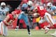 KANSAS CITY, MO - DECEMBER 26: Chris Johnson #28 of the Tennessee Titans carries the ball as Mike Vrabel #50 and Derrick Johnson #56 of the Kansas City Chiefs defend during the game on December 26, 2010 at Arrowhead Stadium in Kansas City, Missouri. (Photo by Jamie Squire/Getty Images)