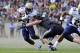 Oct 6, 2012; Colorado Springs, CO, USA; Navy Midshipmen running back Gee Gee Greene (21) runs for a gain in the first quarter against the Air Force Falcons at Falcon Stadium. Mandatory Credit: Ron Chenoy-USA TODAY Sports