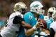 NEW ORLEANS, LA - SEPTEMBER 30: Ryan Tannehill #17 of the Miami Dolphins is sacked by Junior Galette #93 of the New Orleans Saints at the Mercedes-Benz Superdome on September 30, 2013 in New Orleans, Louisiana. (Photo by Chris Graythen/Getty Images)