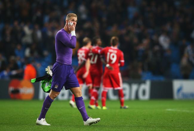 Hi-res-182937506-goalkeeper-joe-hart-of-manchester-city-looks-dejected_crop_north