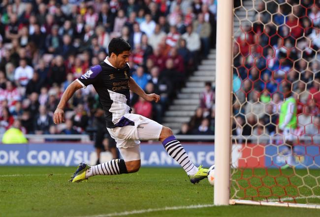 Hi-res-182287332-luis-suarez-of-liverpool-scores-his-teams-second-goal_crop_north