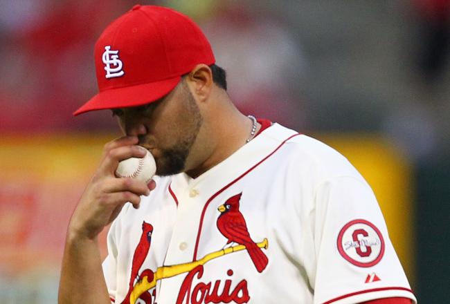 Hi-res-182239976-reliever-edward-mujica-of-the-st-louis-cardinals-kisses_crop_north