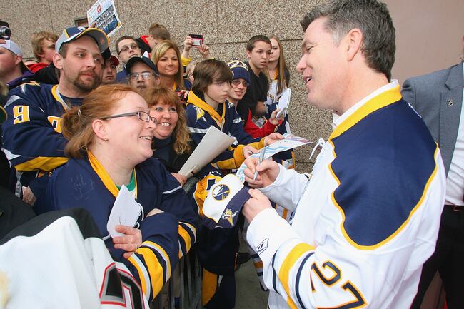 Hi-res-111913897-buffalo-sabres-alumnus-brad-may-signs-autographs-on-fan_crop_north
