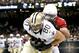 Sep 22, 2013; New Orleans, LA, USA; Arizona Cardinals defensive back Tyrann Mathieu (32) tackles New Orleans Saints tight end Jimmy Graham (80) during the third quarter of a game at Mercedes-Benz Superdome. Mandatory Credit: Derick E. Hingle-USA TODAY Sports