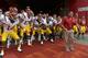Apr 13, 2013; Los Angeles, CA, USA; Southern California Trojans defensive line coach Ed Orgeron leads players Ryan Henderson (14), Devian Shelton (17), and Anthony Sarao (56), and Demetrius Wright (24) and Kevin Greene (81) on the field before the spring game at the Los Angeles Memorial Coliseum. Mandatory Credit: Kirby Lee-USA TODAY Sports