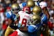 PASADENA, CA - OCTOBER 13: Cornerback Fabian Moreau #10 of the UCLA Bruins leads a swarm of Bruins as they tackle wide receiver Charles Henderson #85 of the Utah Utes at the Rose Bowl on October 13, 2012 in Pasadena, California. (Photo by Stephen Dunn/Getty Images)