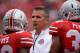 COLUMBUS, OH - SEPTEMBER 21: Head Coach Urban Meyer of the Ohio State Buckeyes watches his team warm up before playing the Florida A&M Rattlers at Ohio Stadium on September 21, 2013 in Columbus, Ohio. Ohio State defeated FAMU 76-0. (Photo by Jamie Sabau/Getty Images)