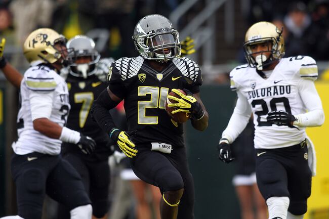 Hi-res-154841327-kenjon-barner-of-the-oregon-ducks-runs-runs-for-a_crop_north