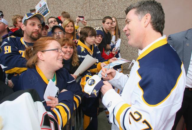 Hi-res-111913897-buffalo-sabres-alumnus-brad-may-signs-autographs-on-fan_crop_north