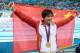 Jul 31, 2012; London, United Kingdom; Ye Shiwen (CHN) poses with her gold medal and a China flag after winning the women's 200m individual medley finals during the London 2012 Olympic Games at Aquatics Centre. Mandatory Credit: Kirby Lee-USA TODAY Sports