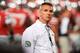 COLUMBUS, OH - SEPTEMBER 28: Head Coach Urban Meyer of the Ohio State Buckeyes watches his team warm up before a game against the Wisconsin Badgers at Ohio Stadium on September 28, 2013 in Columbus, Ohio. (Photo by Jamie Sabau/Getty Images)