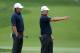 Oct 3, 2013; Dublin, OH, USA; Hunter Mahan and Brandt Snedeker line up a putt on the first green during the Thursday four ball matches of the Presidents Cup at Muirfield Village Golf Club. Mandatory Credit: Brian Spurlock-USA TODAY Sports