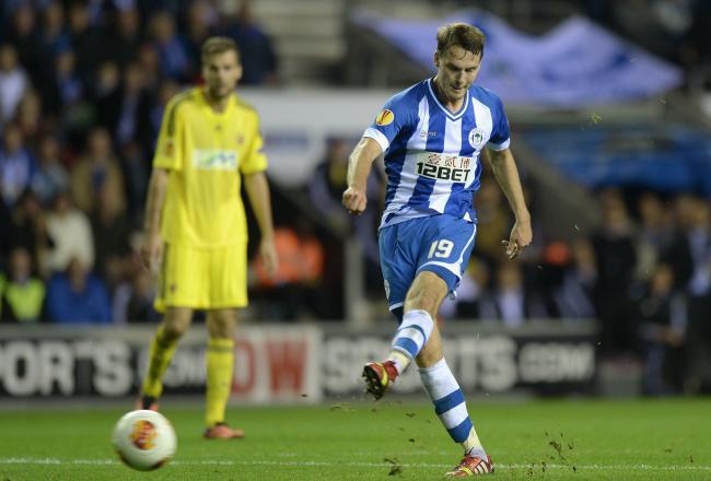 Hi-res-183002464-nick-powell-of-wigan-scores-his-teams-3rd-goal-duirng_crop_north