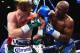 LAS VEGAS, NV - SEPTEMBER 14: (L-R) Floyd Mayweather Jr. throws a right to Canelo Alvarez during their WBC/WBA 154-pound title fight at the MGM Grand Garden Arena on September 14, 2013 in Las Vegas, Nevada. (Photo by Al Bello/Getty Images)