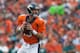 DENVER, CO - SEPTEMBER 29: Quarterback Peyton Manning #18 of the Denver Broncos rolls out of the pocket and looks for a receiver downfield against the Philadelphia Eagles at Sports Authority Field Field at Mile High on September 29, 2013 in Denver, Colorado. (Photo by Dustin Bradford/Getty Images)