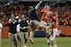 Sep 14, 2013; Chicago, IL, USA; Illinois Fighting Illini quarterback Nathan Scheelhaase (2) reacts with tight end coach Alex Golesh after scoring a touchdown against the Washington Huskies during the second half at Soldier Field. Washington defeats Illinois 34-24. Mandatory Credit: Mike DiNovo-USA TODAY Sports