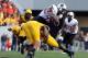 Sep 28, 2013; Morgantown, WV, USA; Oklahoma State Cowboys wide receiver Josh Stewart (5) is tackled by West Virginia Mountaineers safety K.J. Dillon (9) during the fourth quarter at Milan Puskar Stadium. Mandatory Credit: Peter Casey-USA TODAY Sports